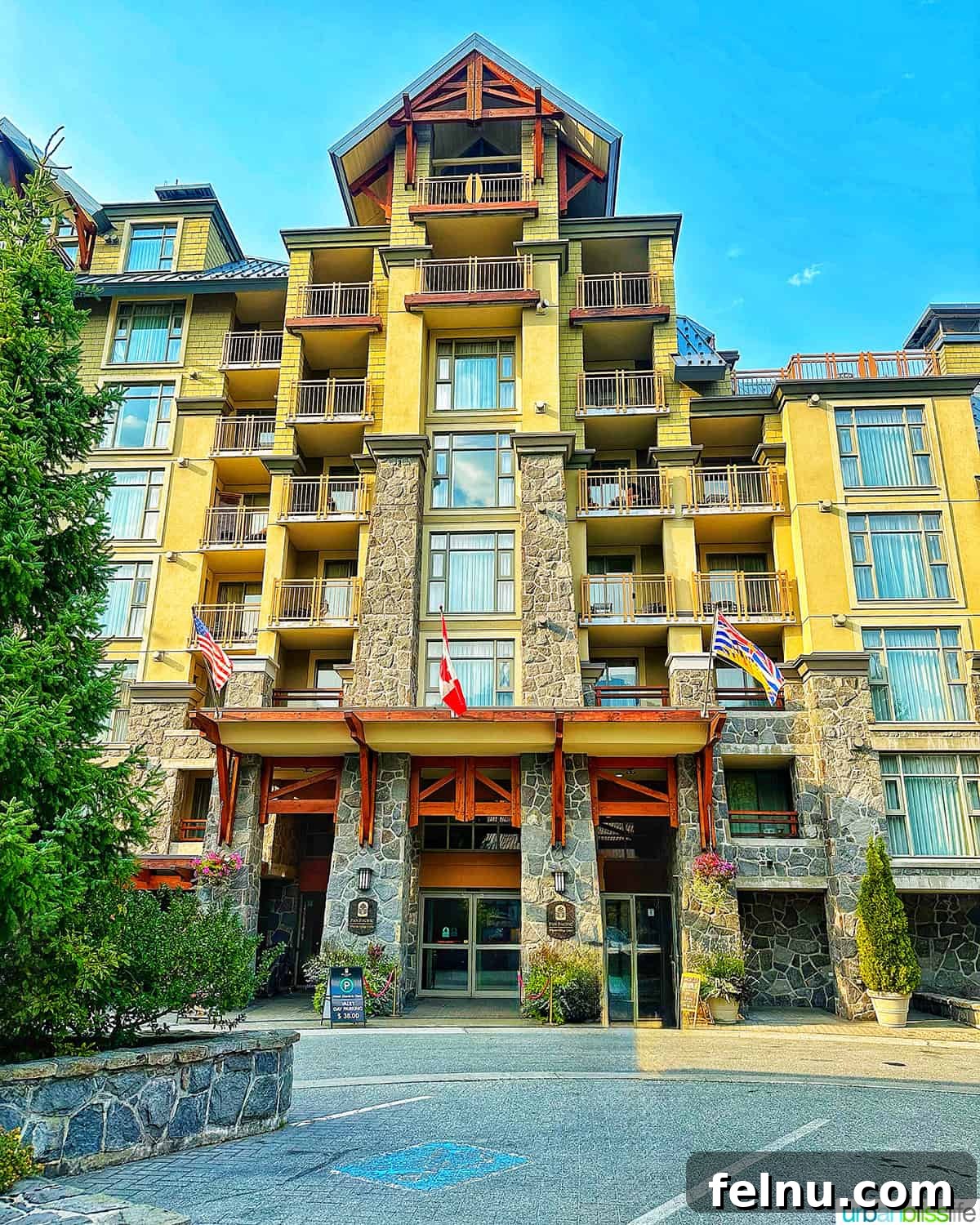 Whistler Village Signature Escape 2 Exterior of the luxurious Pan Pacific Whistler Village Centre Hotel, nestled among the charming alpine architecture of Whistler Village in British Columbia, Canada.