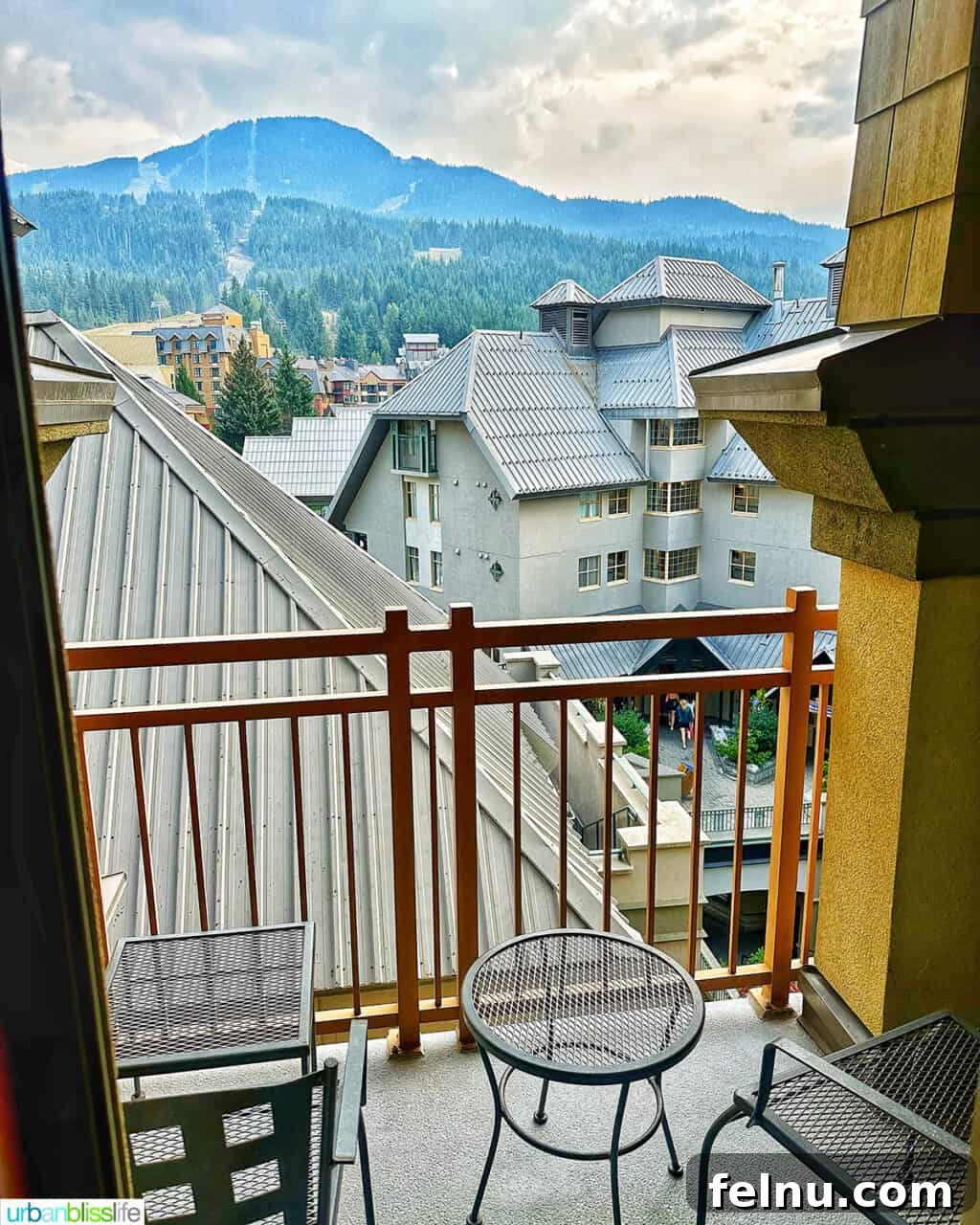 Whistler Village Signature Escape 9 Enchanting view of the snow-capped mountains and Whistler Village from the private balcony of a suite at Pan Pacific Whistler Village Centre Hotel.