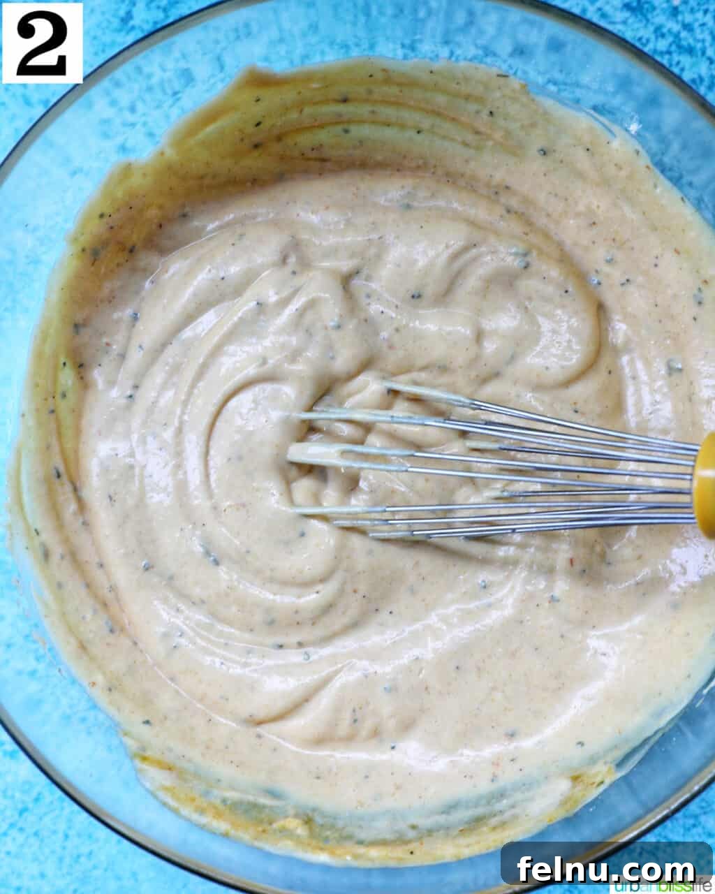 Whisk in a bowl of Buffalo Ranch Sauce.