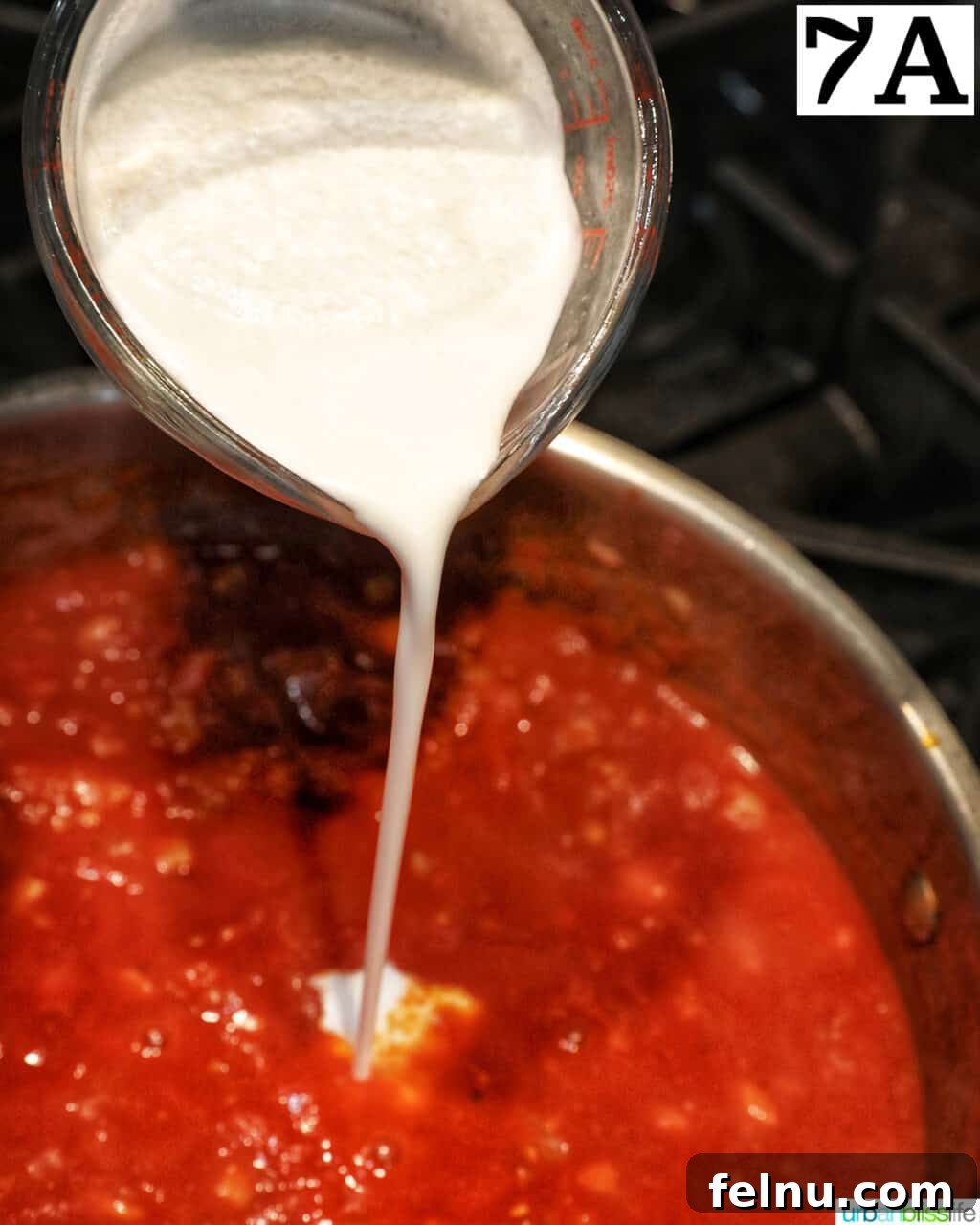 Creamy Dreamy Rigatoni: A Vodka Sauce Delight 12 Adding cream to the sauce