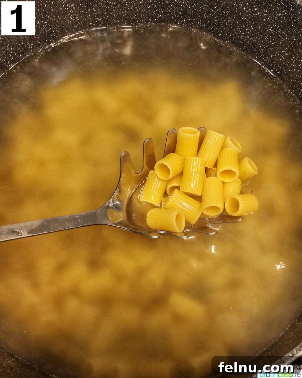 Creamy Dreamy Rigatoni: A Vodka Sauce Delight 5 Cooking rigatoni in boiling water