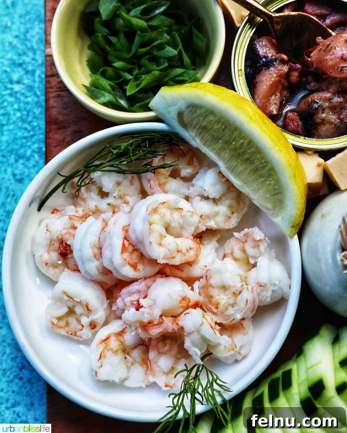 Close-up of succulent shrimp featured on a seacuterie board, highlighting the fresh seafood selection.