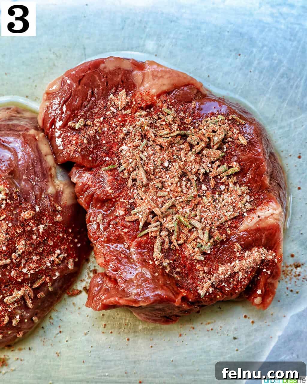 Air Fryer Filet Mignon Perfection 8 raw filet mignon steak with the seasoning blend generously applied to its surface.