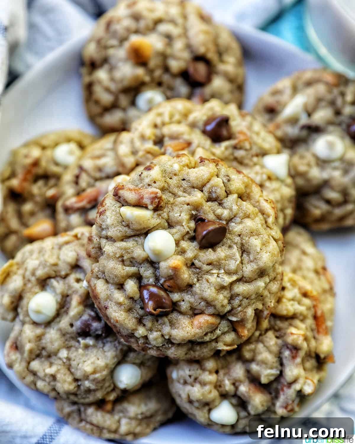 chocolate chip pretzel cookies stacked on a plate.