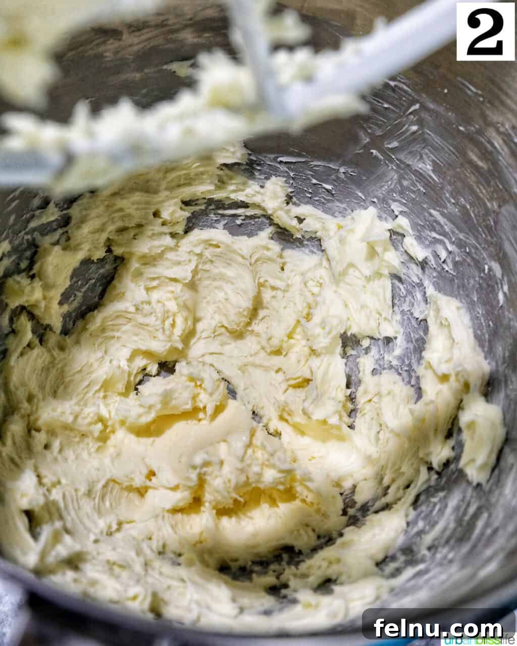 butter creamed in a stand mixer bowl.