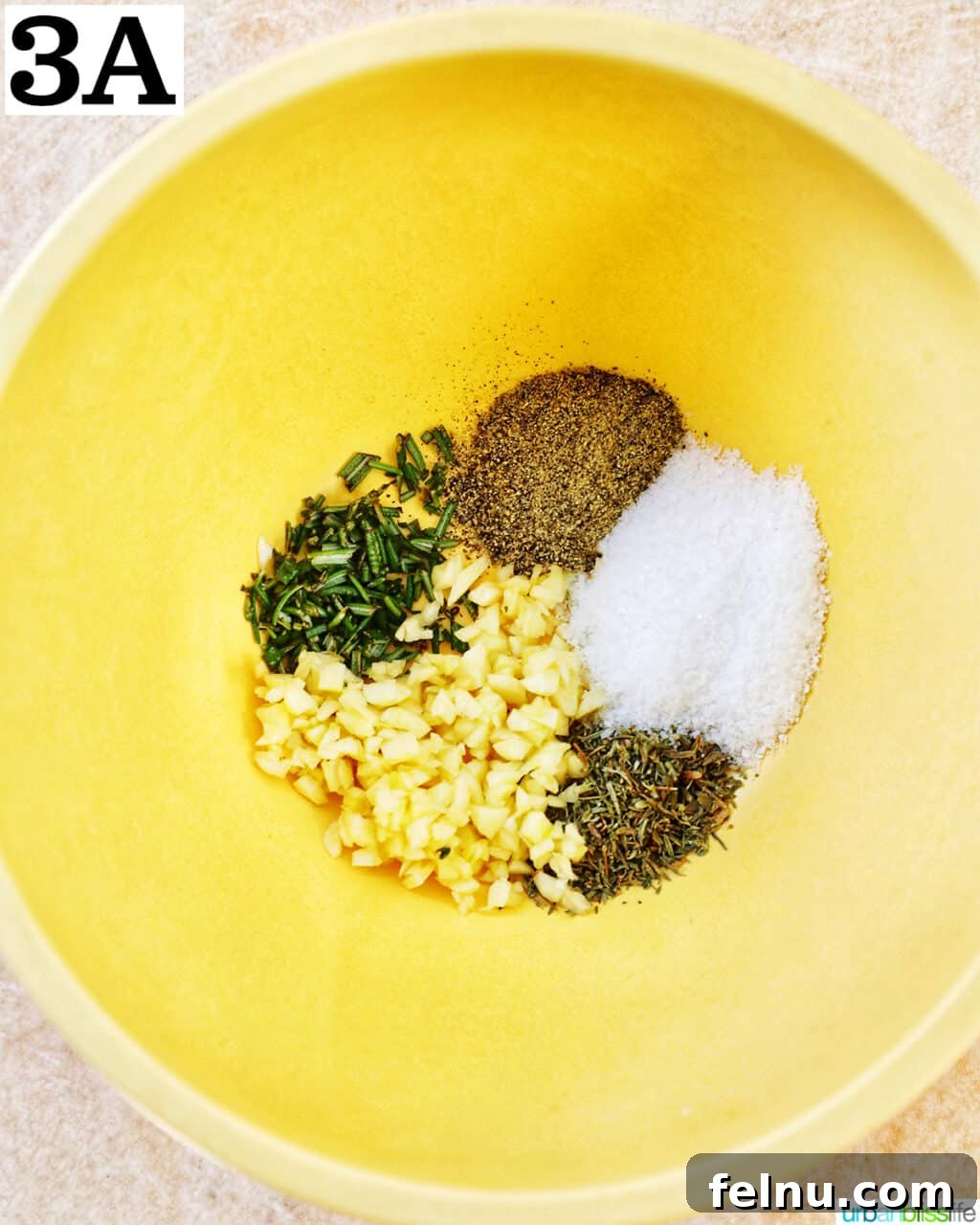 Crispy and Tender Air Fryer Turkey Breast 7 A vibrant yellow bowl brimming with a carefully measured blend of aromatic seasonings.