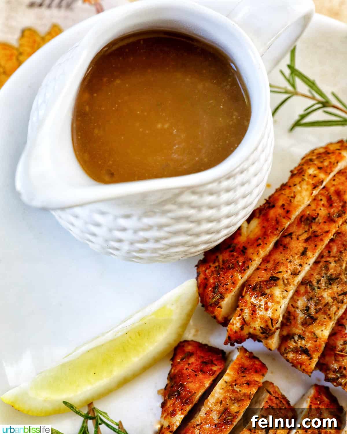 Perfect Air Fryer Turkey Tenderloin 13 Rich, savory turkey gravy served in an elegant gravy boat, accompanied by perfectly sliced turkey tenderloin.