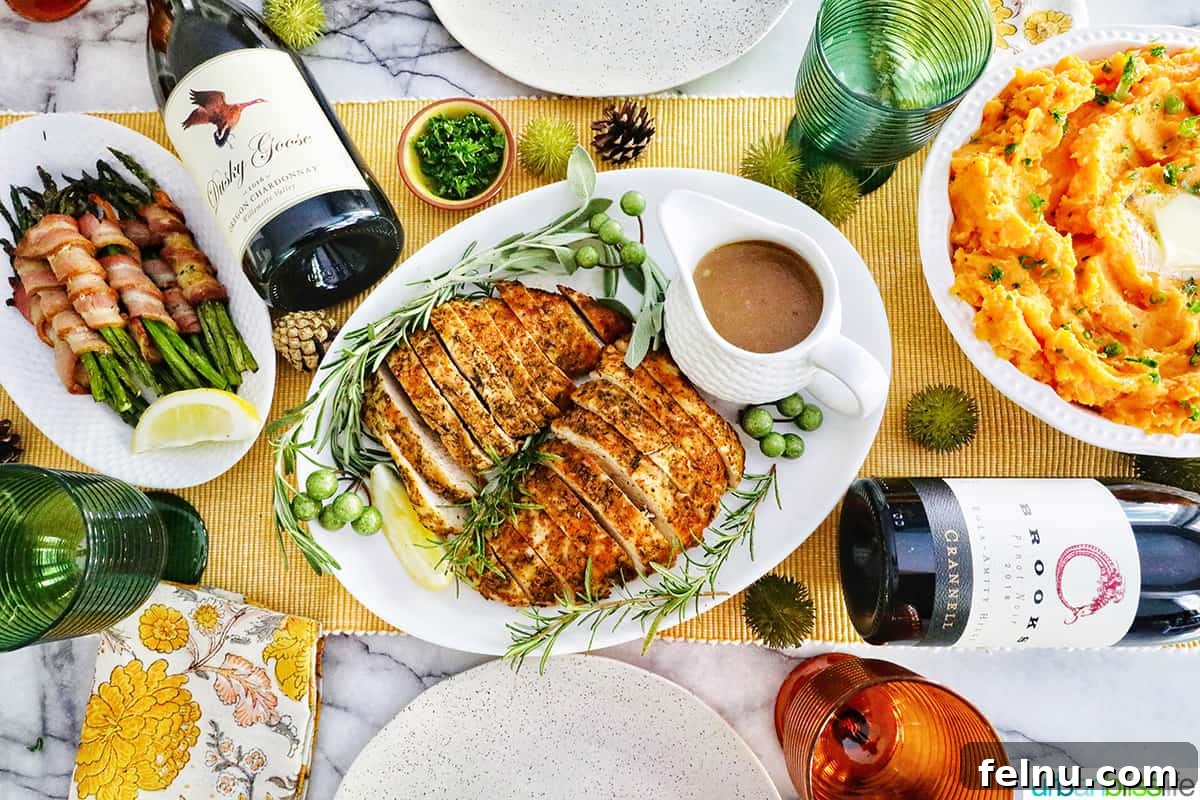 Perfect Air Fryer Turkey Tenderloin 15 A festive Thanksgiving table laden with sliced turkey tenderloin, creamy whipped sweet potatoes, savory bacon-wrapped asparagus, and fine bottles of wine, captured from an overhead view.