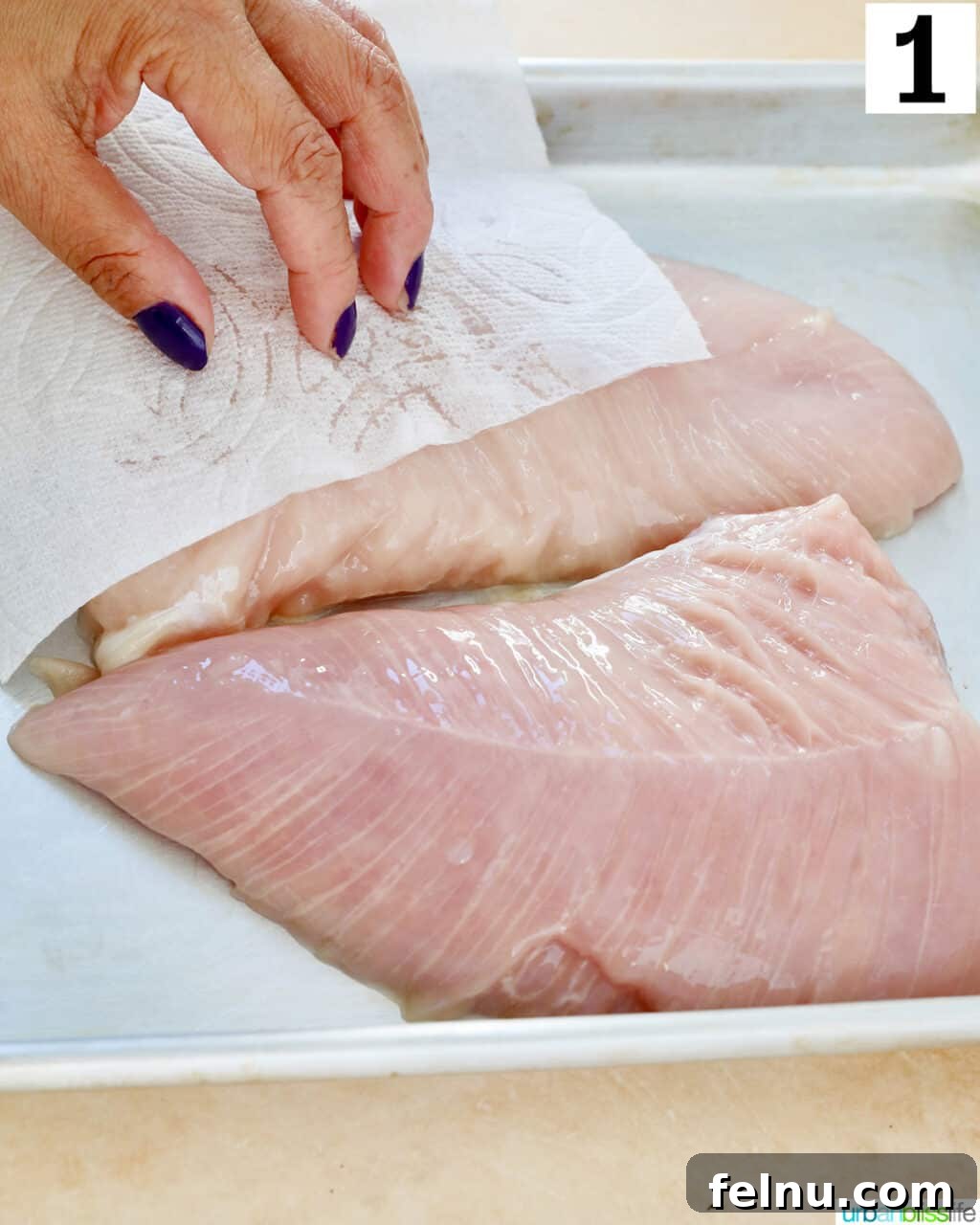 Perfect Air Fryer Turkey Tenderloin 5 Patting turkey tenderloins dry with paper towels to ensure a crispy exterior.