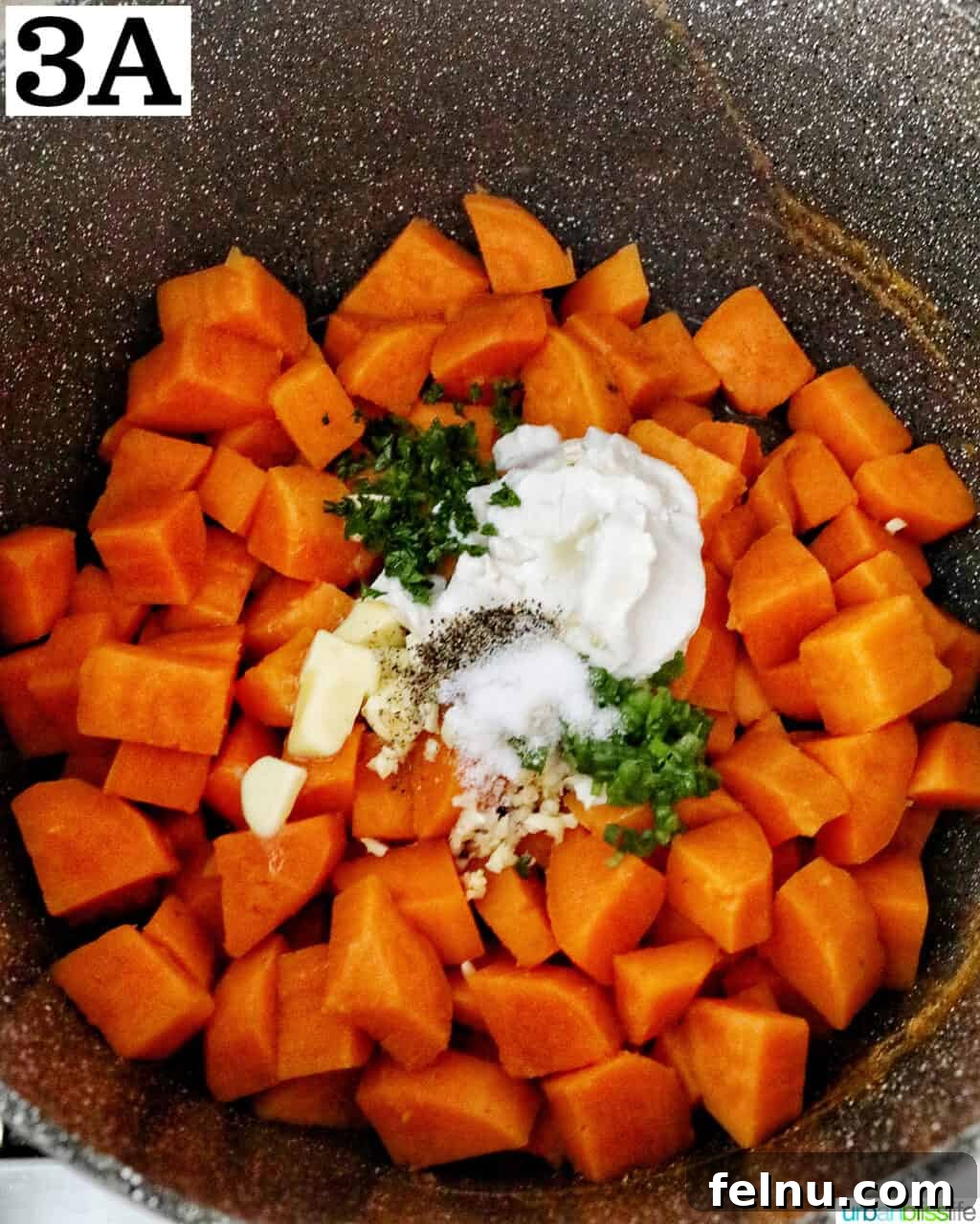 Silky Sweet Potato Puree 7 sour cream, butter, garlic, and herbs on top of chopped sweet potatoes in a large pot.