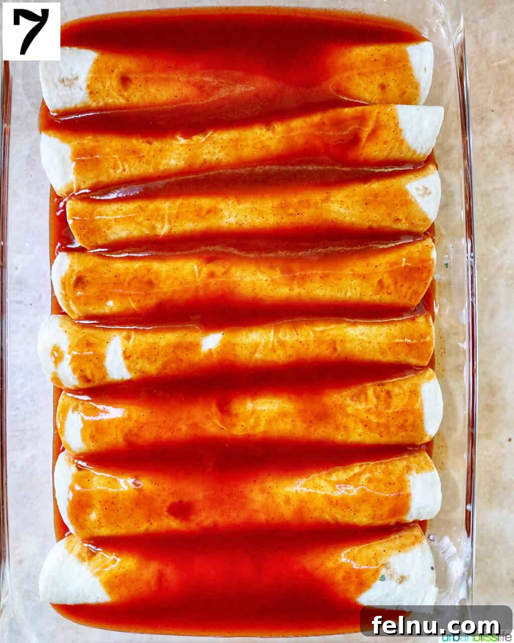 Delicious Leftover Turkey Enchilada Casserole 12 Remaining enchilada sauce poured evenly over the rolled tortillas in the baking dish.