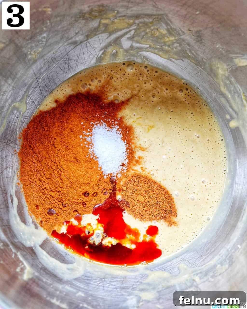 Spices being added to the creamy cinnamon pie batter.