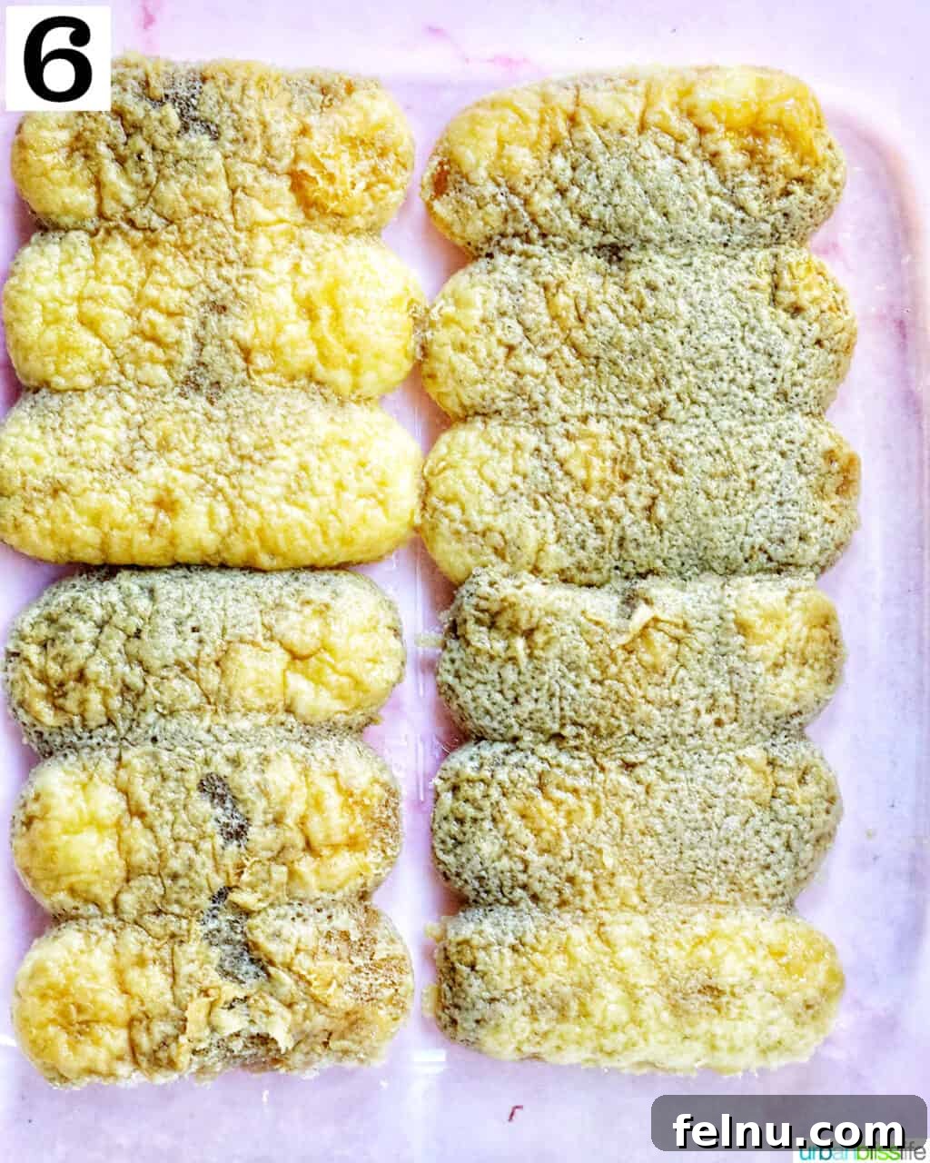 Decadent Dairy-Free Tiramisu 13 The first layer of coffee and Marsala-soaked ladyfingers neatly arranged in a clear square baking dish.