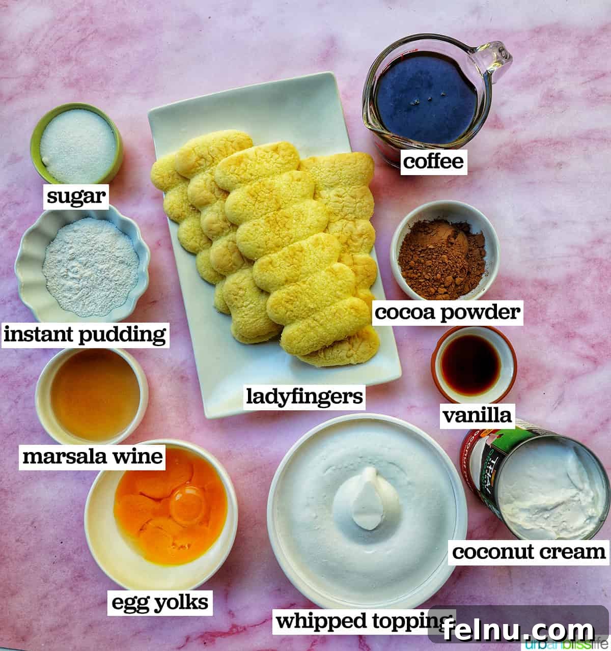 Decadent Dairy-Free Tiramisu 4 Various bowls holding ingredients for dairy-free tiramisu, including egg yolks, coffee, and coconut cream.