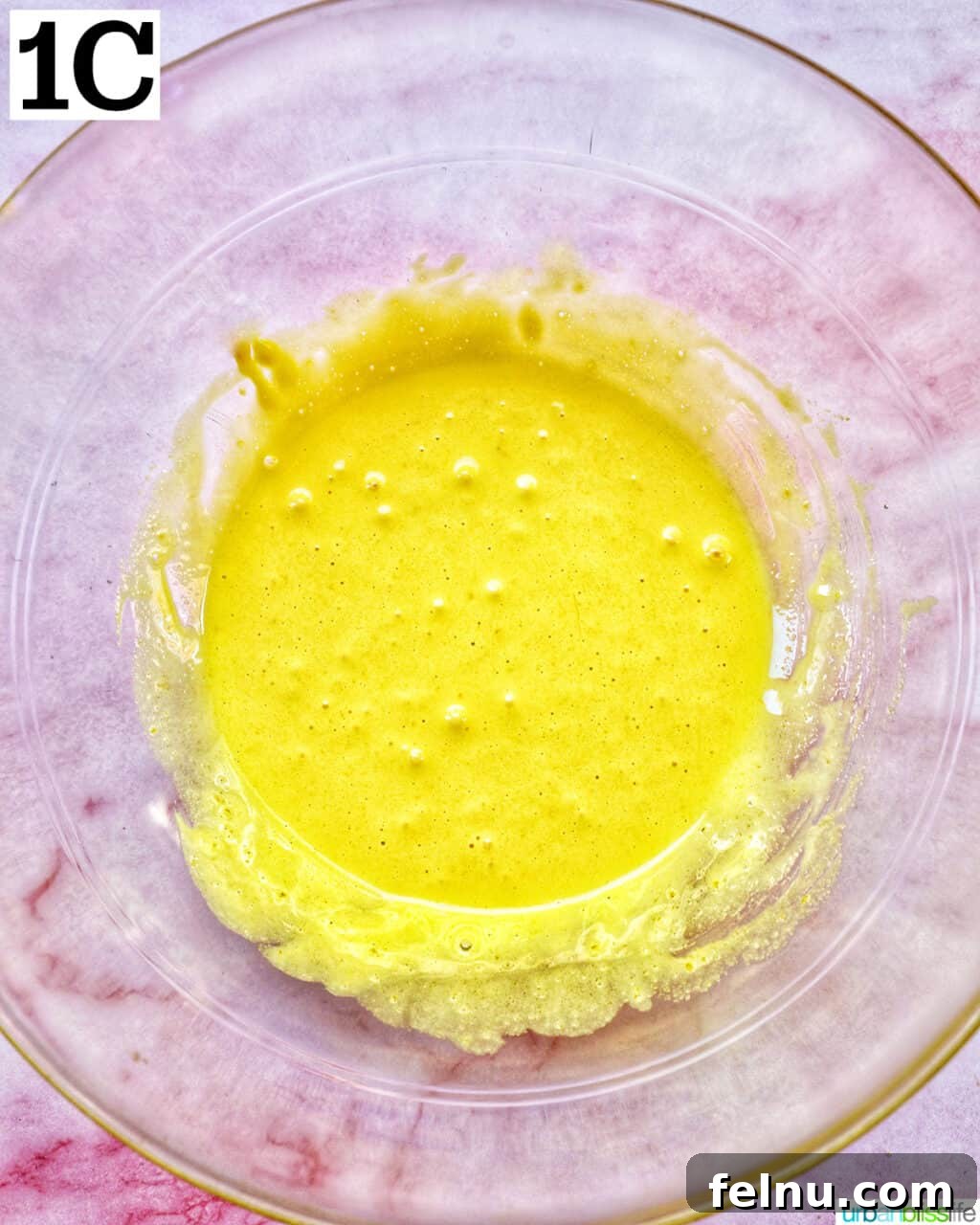 Decadent Dairy-Free Tiramisu 7 A bowl containing the smooth, light yellow egg yolk and sugar mixture, ready for the next steps.