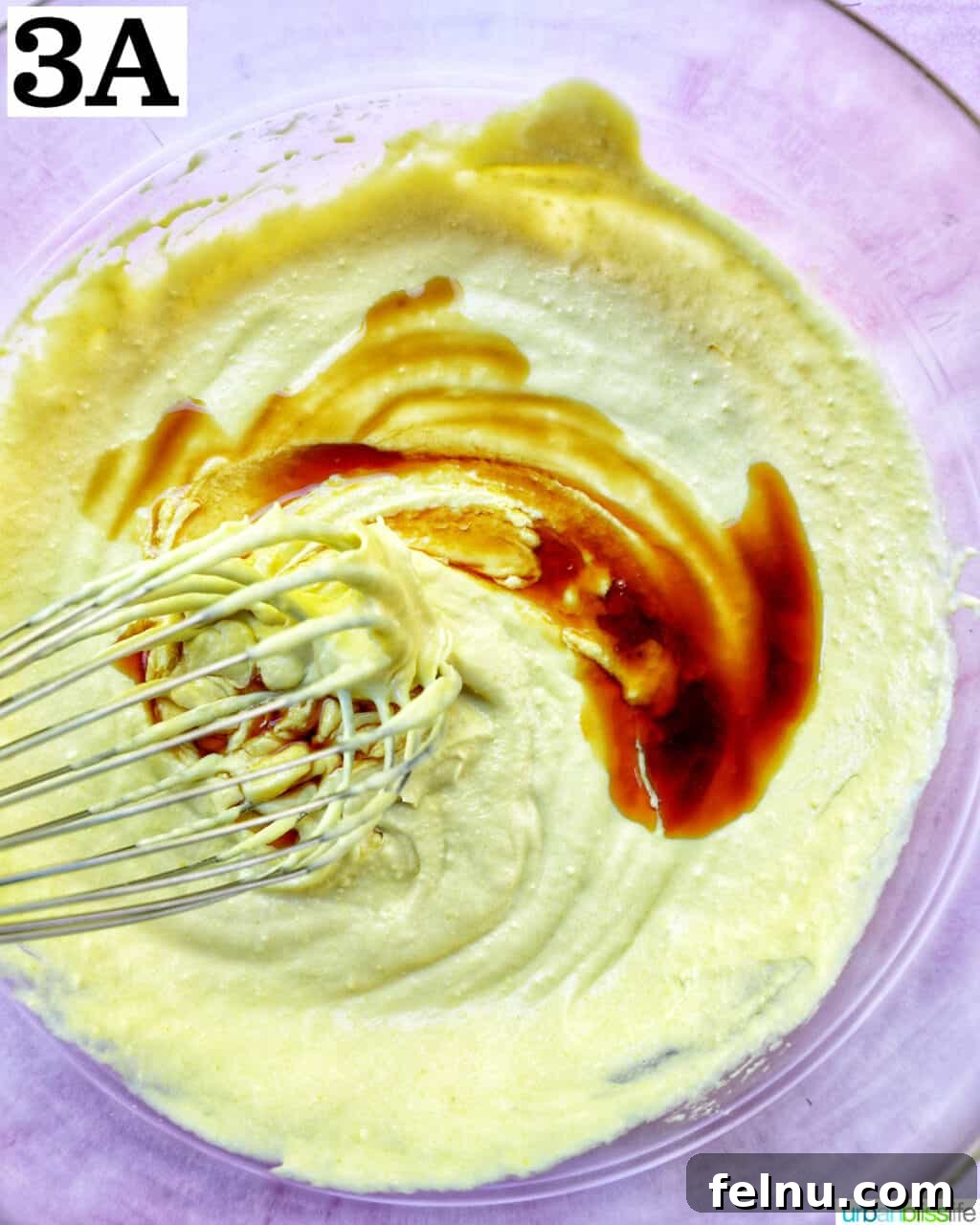 Decadent Dairy-Free Tiramisu 9 A whisk incorporating vanilla extract into the creamy egg yolk mixture.