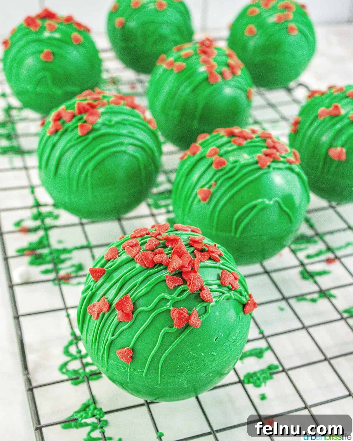 Grinch Hot Chocolate Bombs with sprinkles