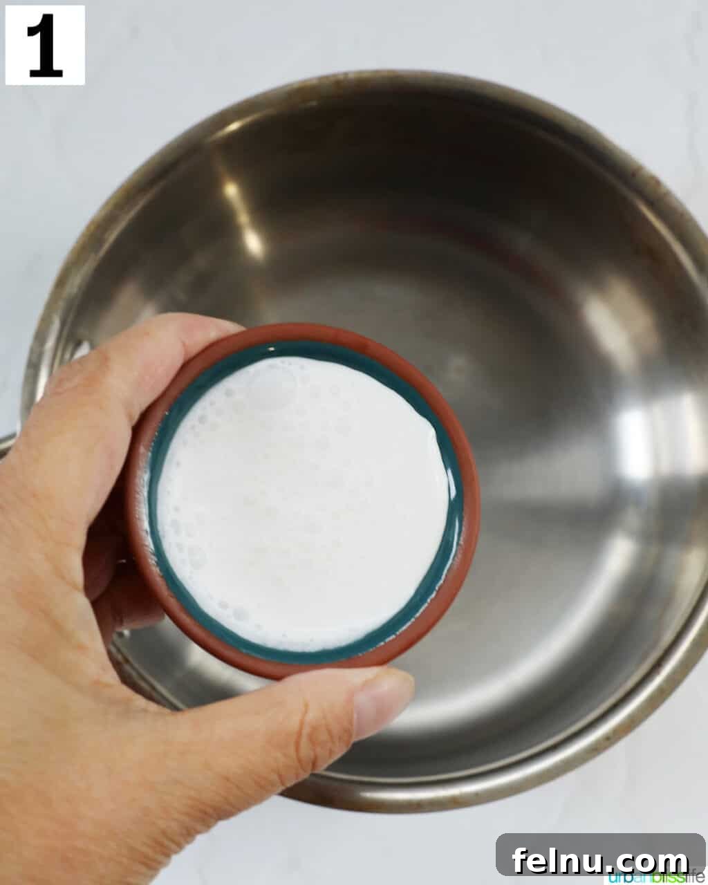 Heating heavy cream in a saucepan