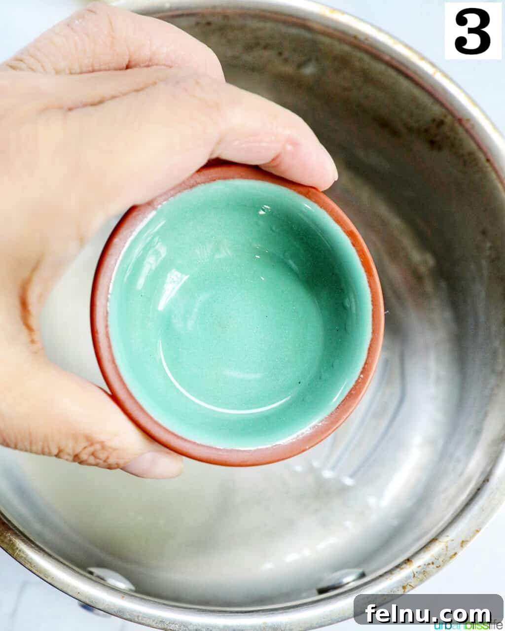 Adding peppermint extract to the saucepan