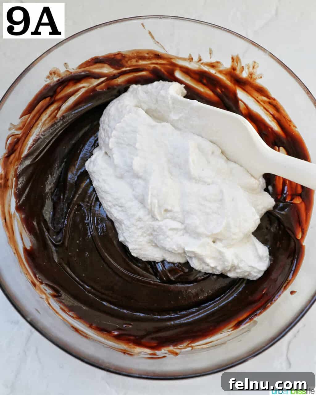 Cool Mint Chocolate Indulgence 13 Gently folding airy whipped cream into the rich melted chocolate mixture with a silicone spatula for the pie filling.