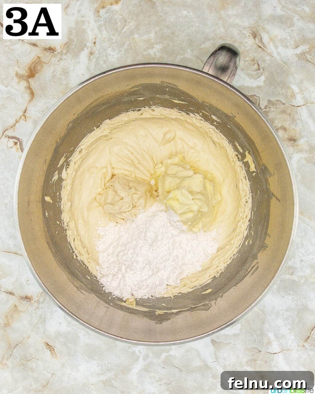 Espresso Mascarpone Macarons 17 Stand mixer bowl with the ganache being whipped to a light and fluffy texture.