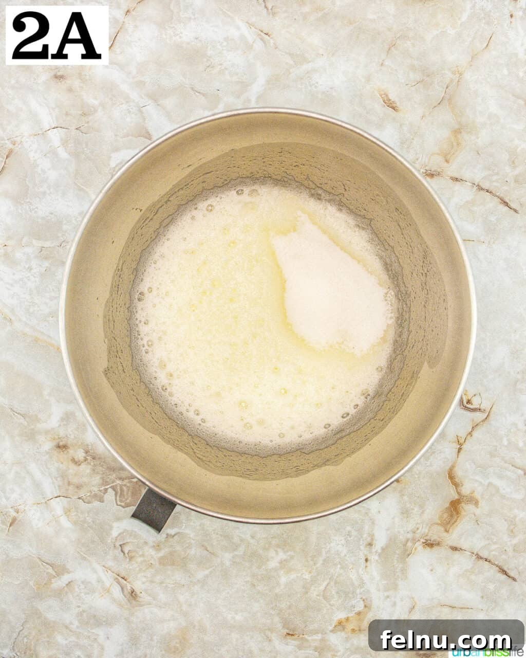 Espresso Mascarpone Macarons 6 Stand mixer bowl with egg whites and meringue powder beginning to stiffen.