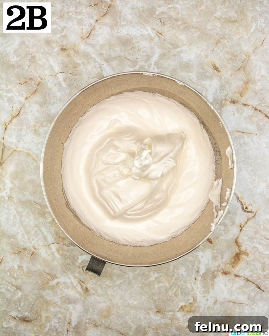 Espresso Mascarpone Macarons 7 Stand mixer bowl with meringue forming very stiff peaks.