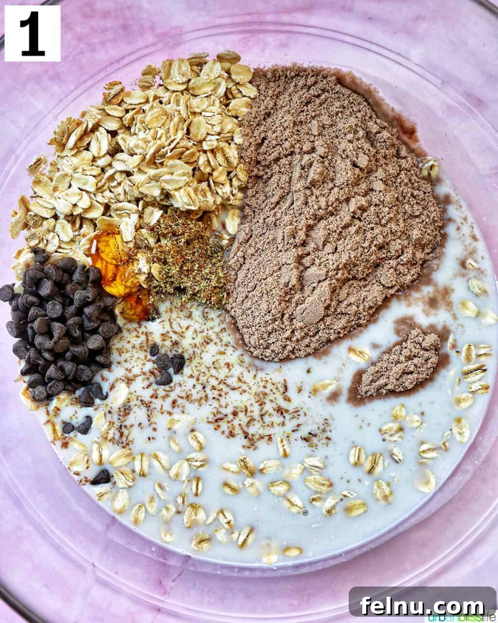 Chocolate Protein Power Oats 5 Ingredients for chocolate protein overnight oats in a large glass bowl.