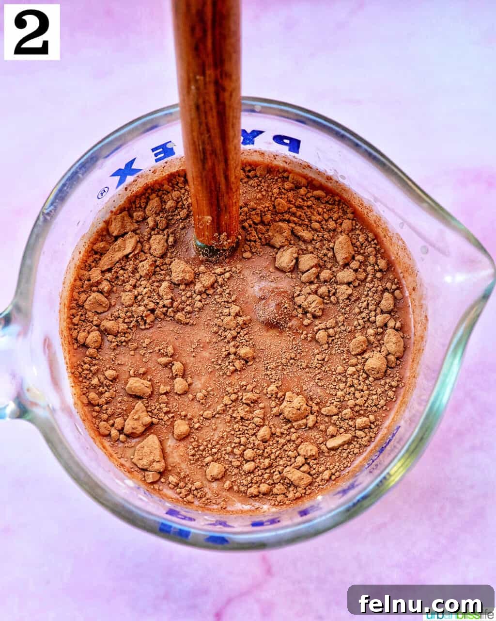 Chocolate Protein Power Oats 6 Mixing in chocolate in a measuring cup.