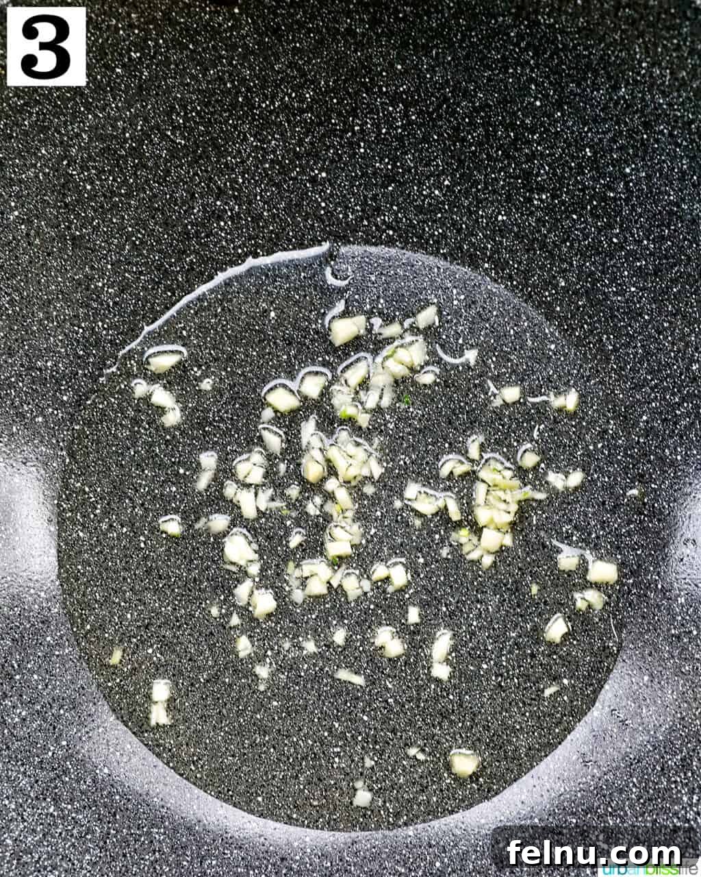 Savory Garlic Adobo Fried Rice 7 Minced garlic sizzling in hot oil in a wok, creating an aromatic base for the fried rice.