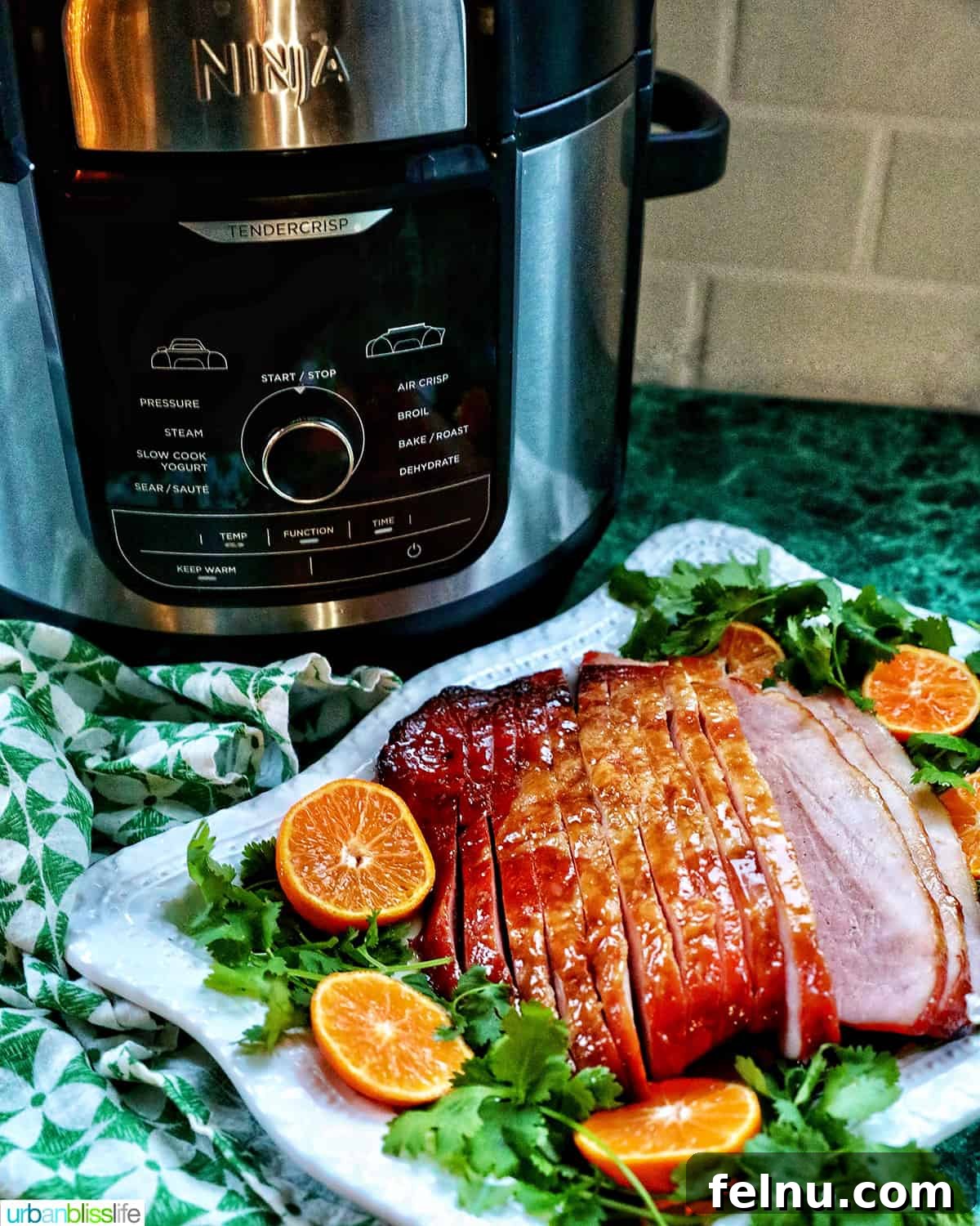 Air Fryer Ham Orijinal Başlık: Crispy & Quick: Air Fryer Ham Recipe 16 Ninja Foodi air fryer with an air fryer ham plated in front of it
