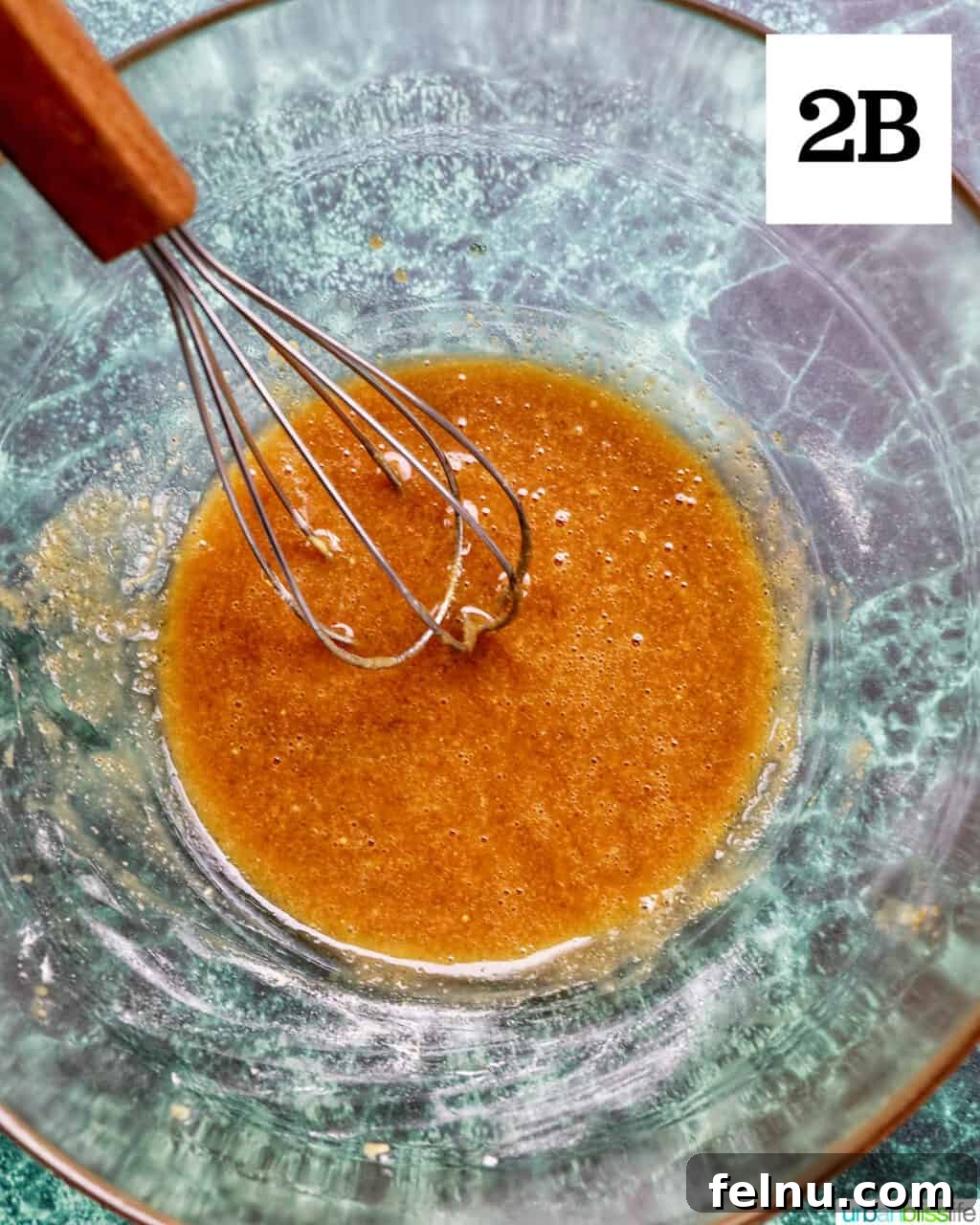 Air Fryer Ham Orijinal Başlık: Crispy & Quick: Air Fryer Ham Recipe 8 Whisk in bowl with whisked glaze