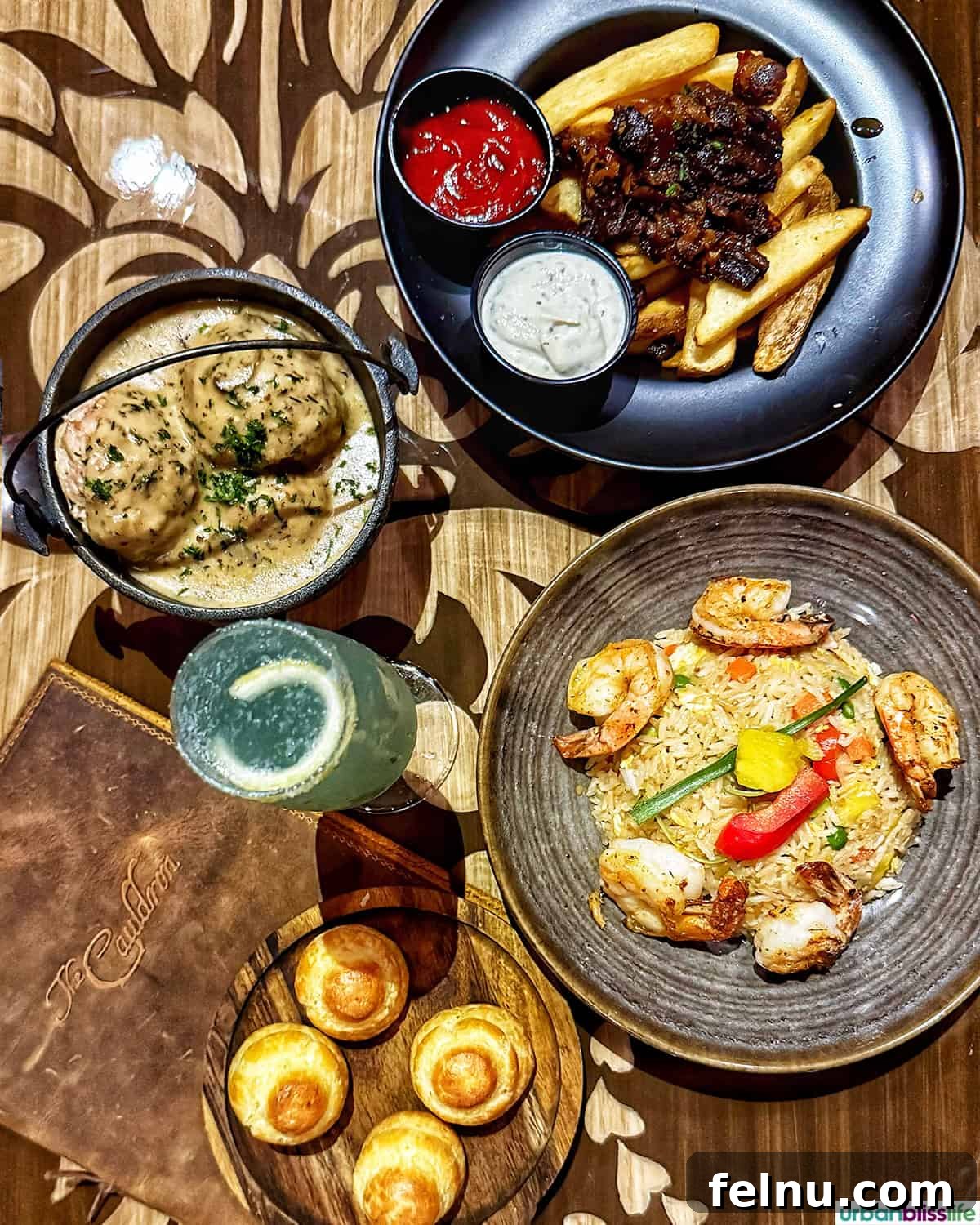 Dining Hotspots in Buena Park 24 A tantalizing top-down view of dinner dishes at The Cauldron Spirits & Brews restaurant in Buena Park, California.