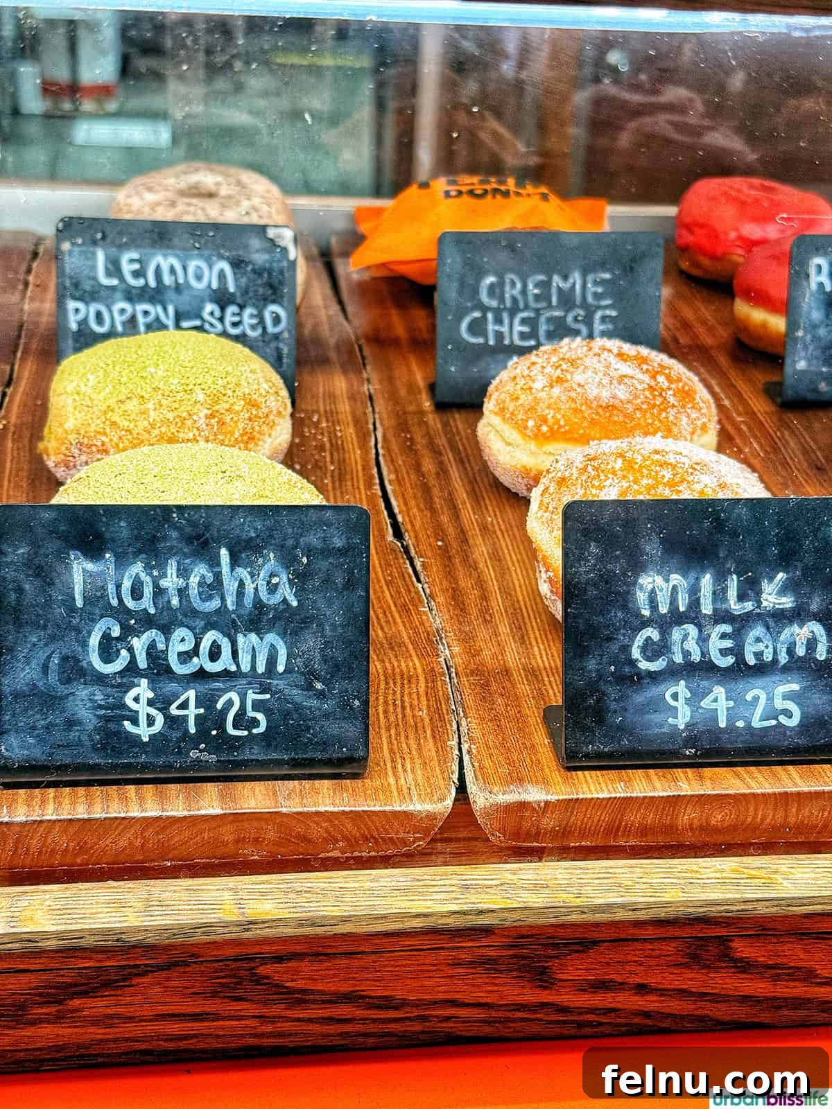 Dining Hotspots in Buena Park 6 A delectable assortment of Old Ferry Donuts, featuring their popular Matcha Cream and Milk Cream varieties, offering a unique and flavorful donut experience.