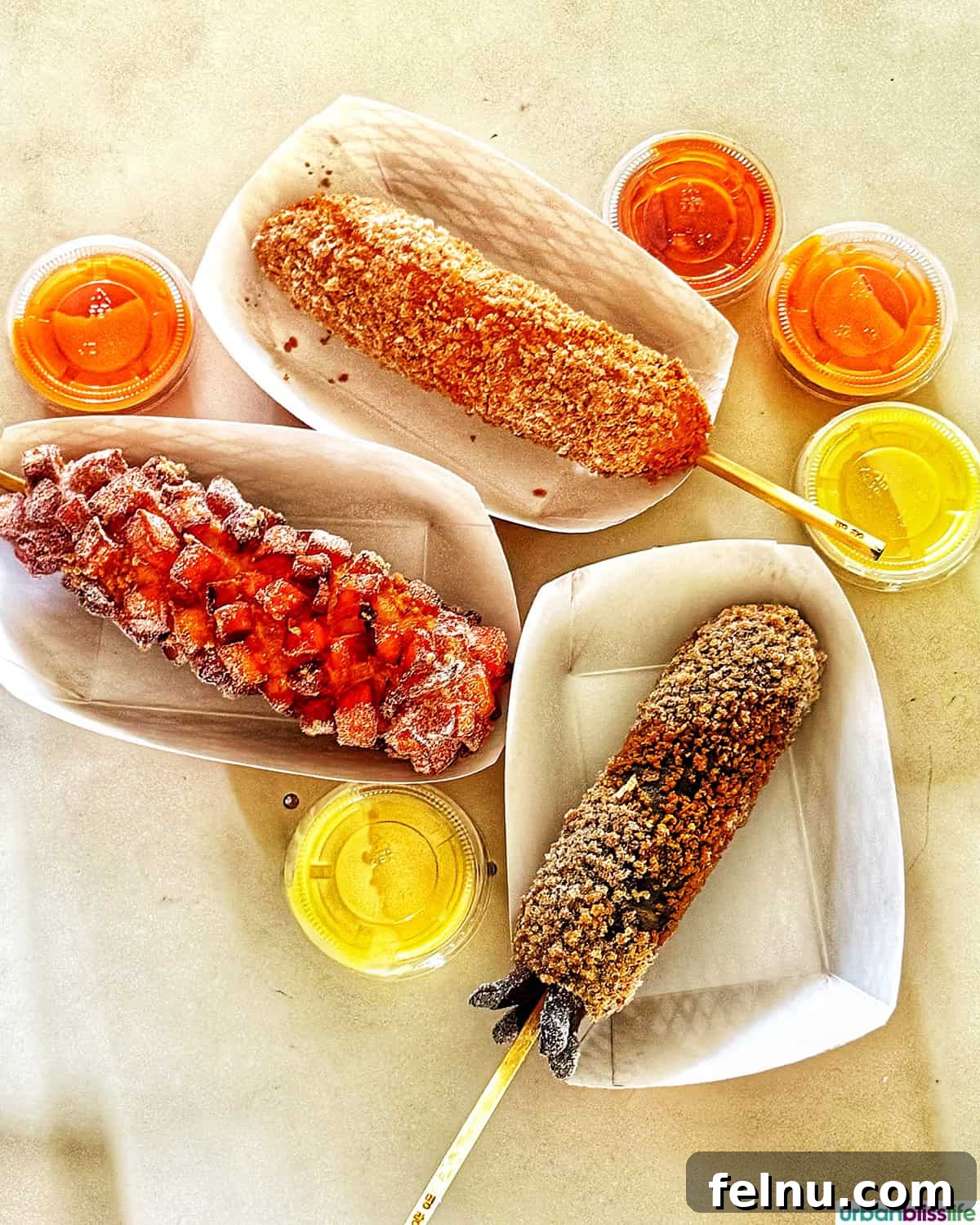 Dining Hotspots in Buena Park 10 A tempting variety of Korean corndogs at Myungrang Hot Dog in Buena Park, California, showcasing the restaurant's unique and flavorful street-food-inspired offerings.
