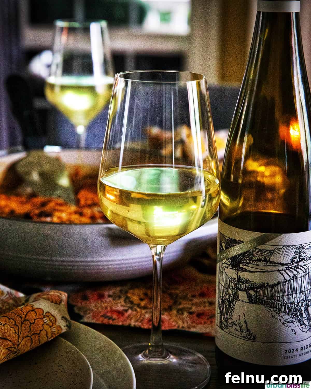 Glass of white wine at the dinner table.