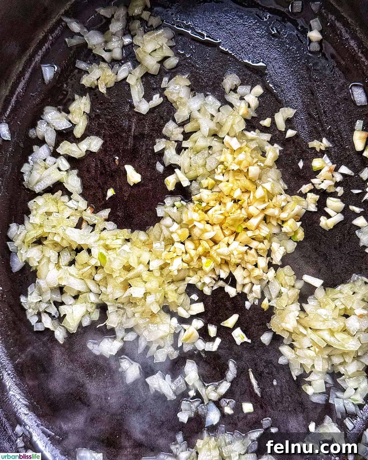 Garlic and onions in a Dutch oven.