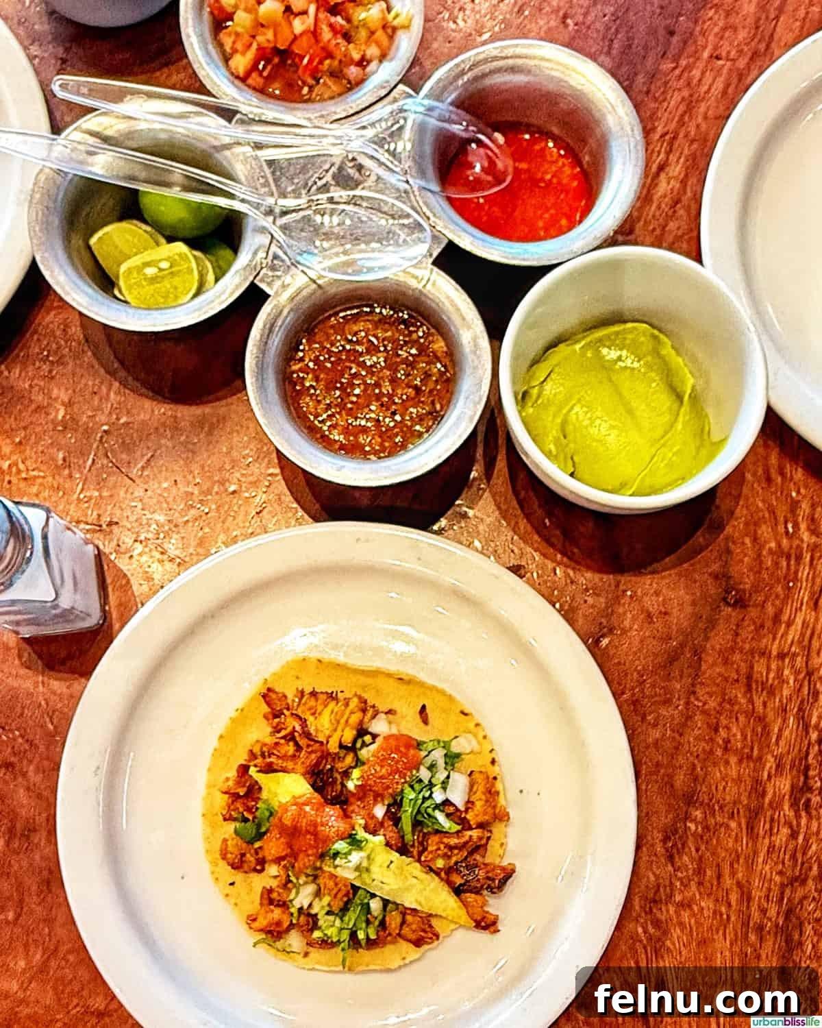The Ultimate Taco Showdown: Cabo's Best Bites 3 A tantalizing taco and an array of colorful, homemade salsas from El Paisa, a beloved local eatery in Cabo San Lucas, Mexico.