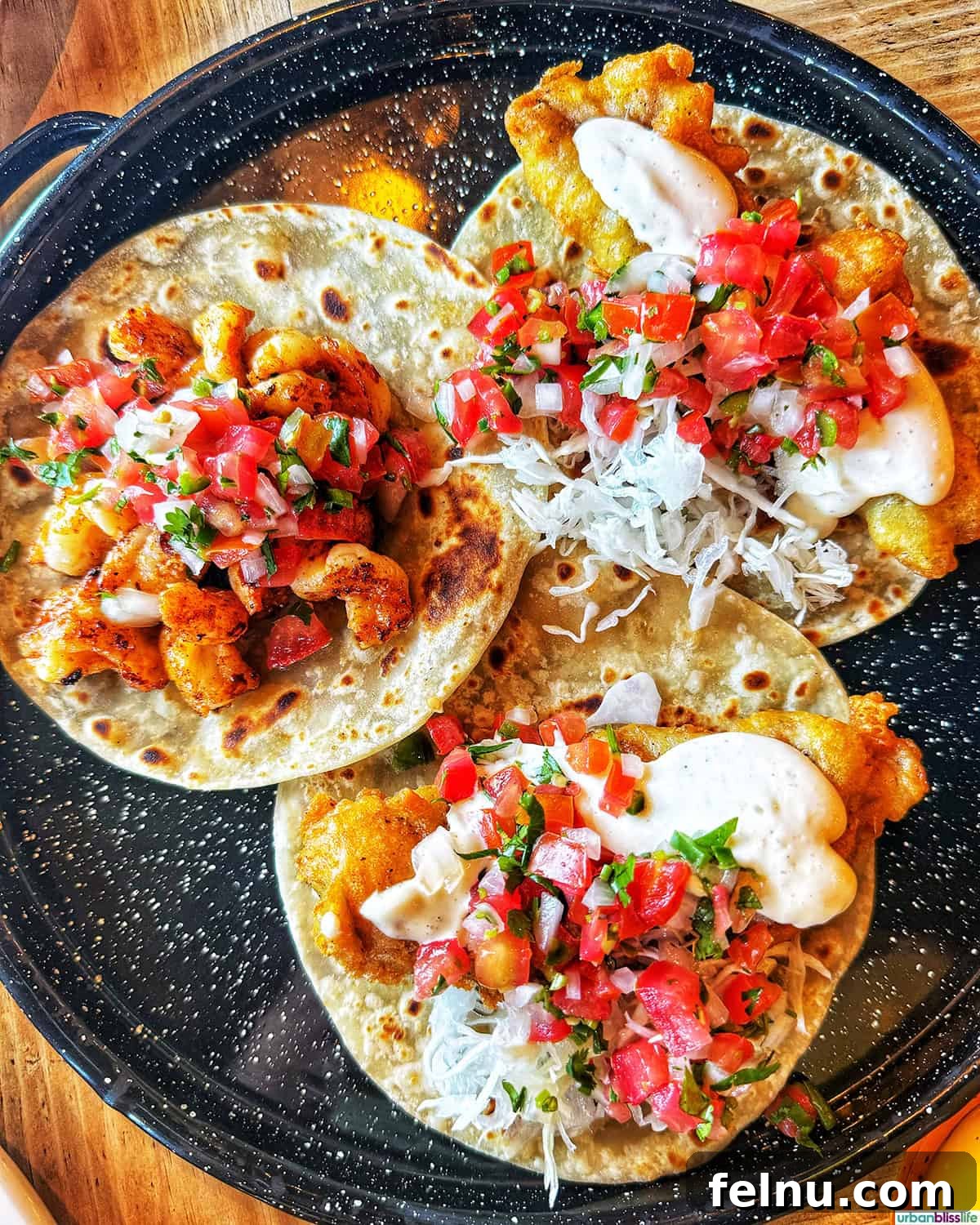 The Ultimate Taco Showdown: Cabo's Best Bites 5 A close-up shot of mouthwatering shrimp tacos and classic Baja-style fish tacos from Mother Flower in Cabo San Lucas, Mexico.