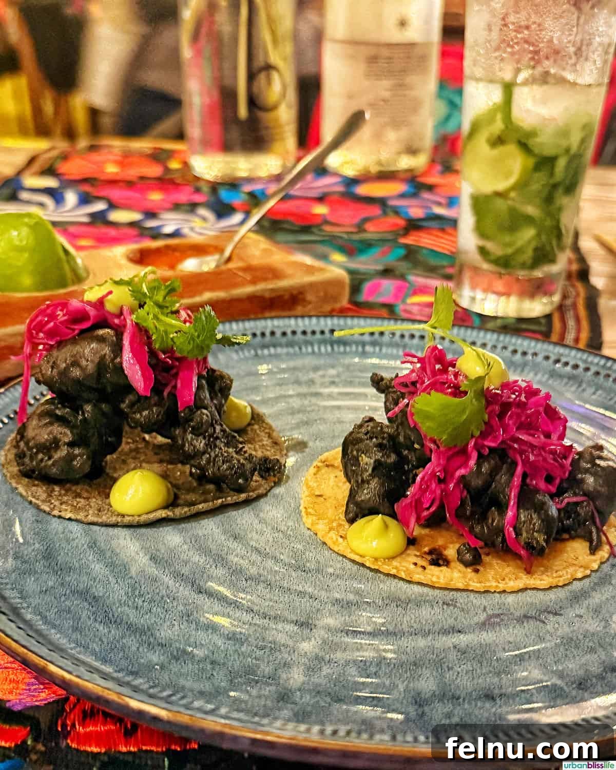 The Ultimate Taco Showdown: Cabo's Best Bites 6 A pair of exquisitely plated Baja fish tacos from Metate in Cabo San Lucas, Mexico, showcasing the restaurant's refined culinary approach.