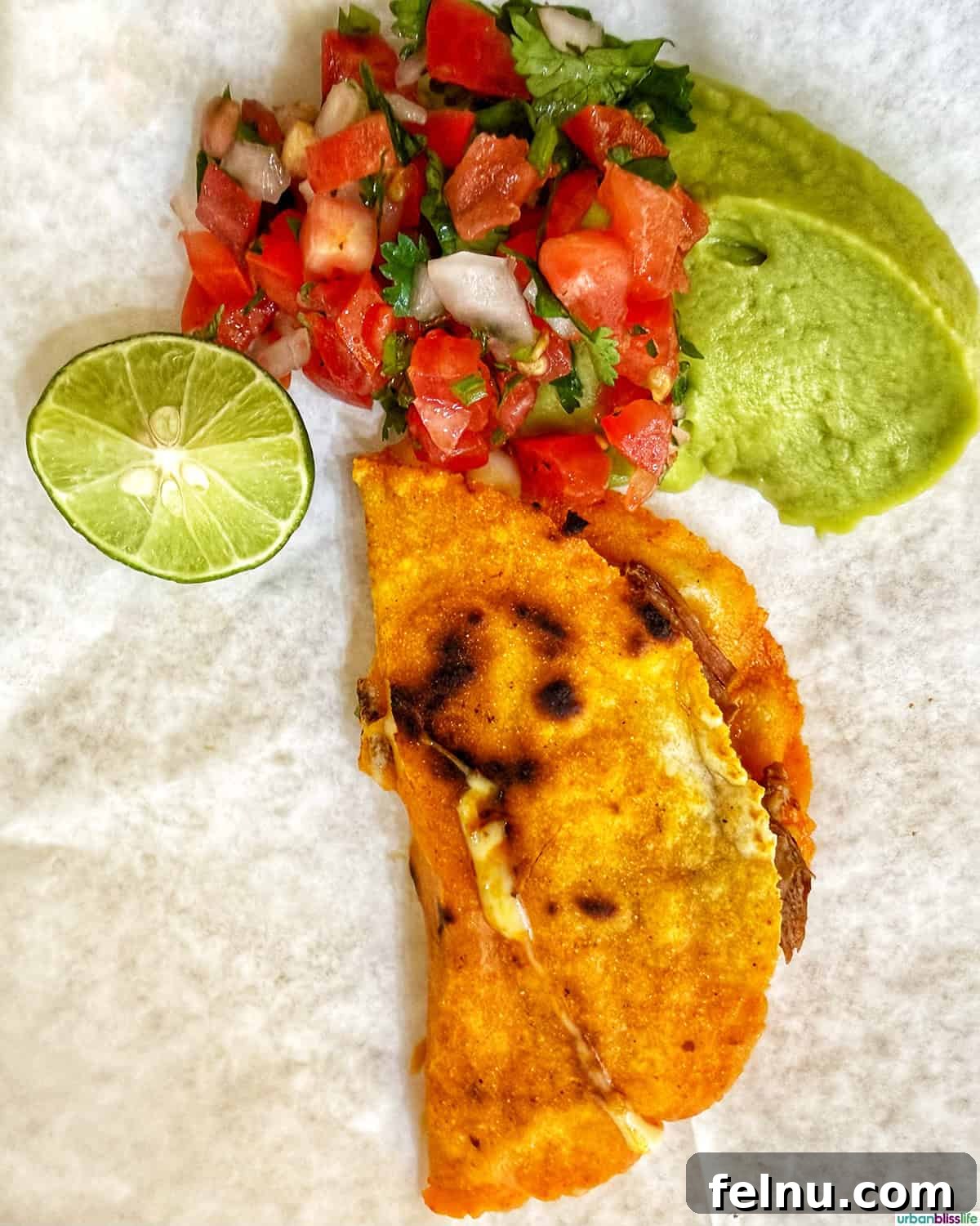 The Ultimate Taco Showdown: Cabo's Best Bites 8 A vibrant taco topped with lime, guacamole, and salsa from Taqueria Morelos, another gem on the Juan More Taco food tour in Cabo San Lucas, Mexico.
