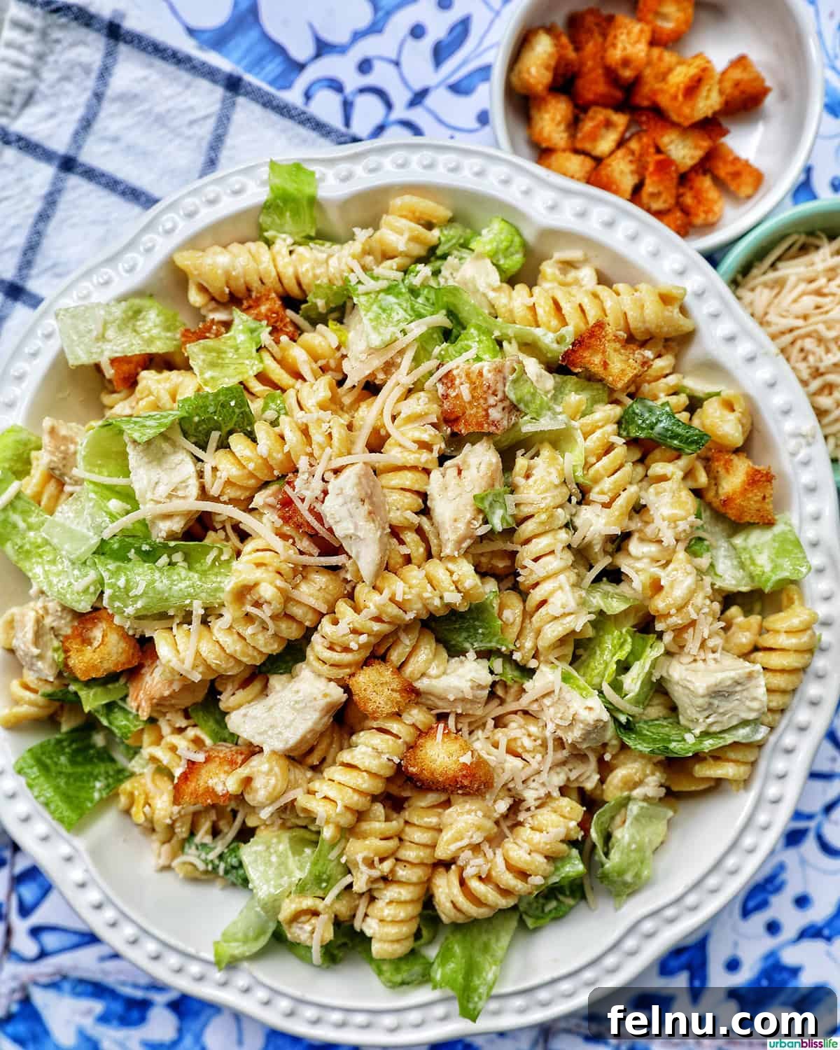 Creamy Caesar Pasta Salad with Crispy Croutons 9 bowl of Caesar pasta salad with side of croutons.