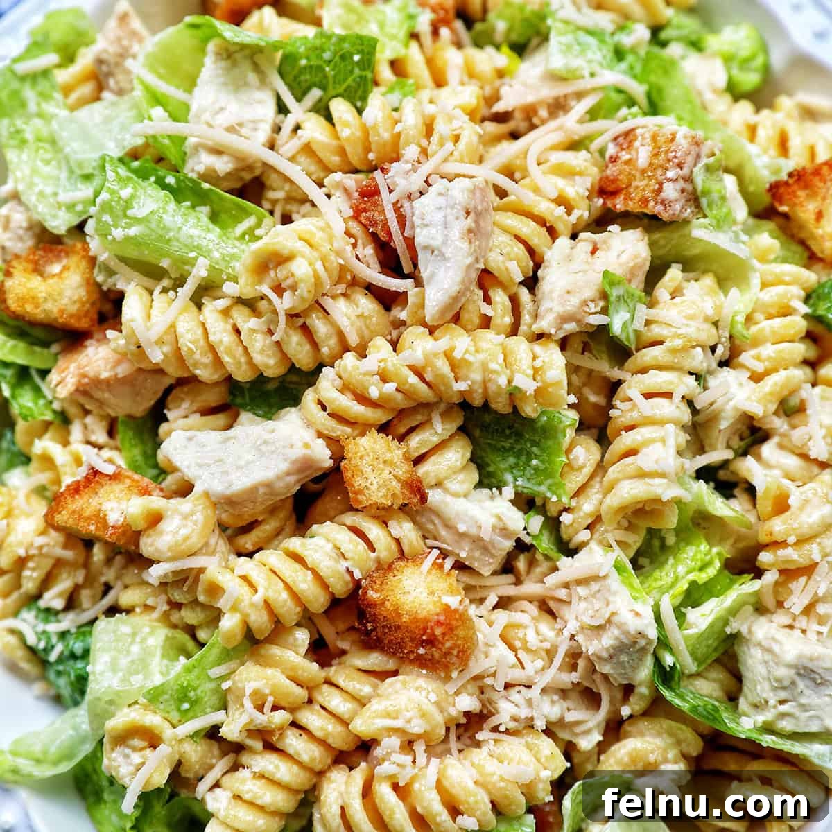 Creamy Caesar Pasta Salad with Crispy Croutons 16 bowl of Caesar pasta salad.