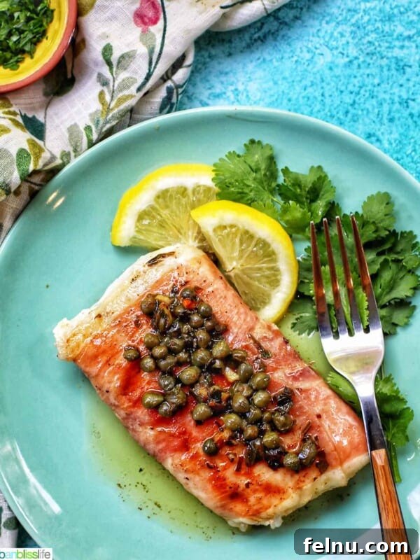 Crispy Air Fryer Cod with Lemon Garlic Butter 16 prosciutto wrapped halibut on a green plate