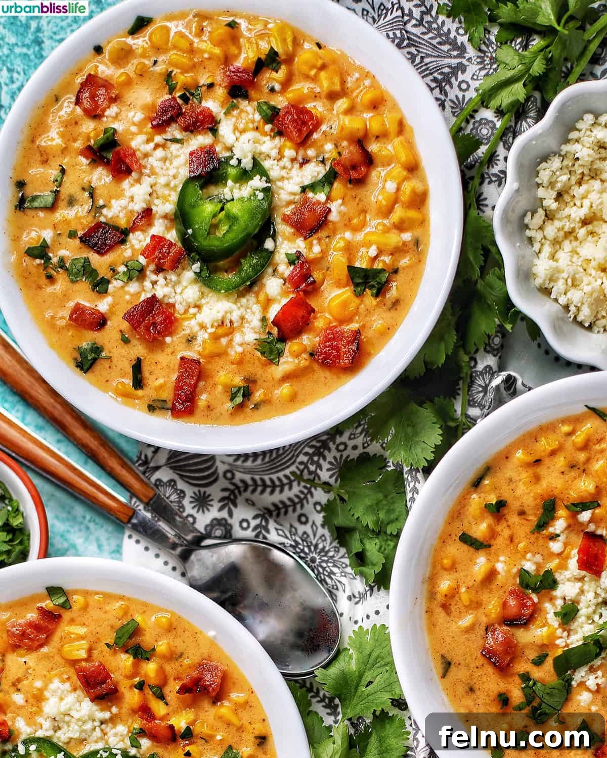 Creamy Instant Pot Mexican Corn Chowder 2 bowls of Instant Pot Mexican Street Corn Chowder with bacon, jalapenos, and Cotija cheese.