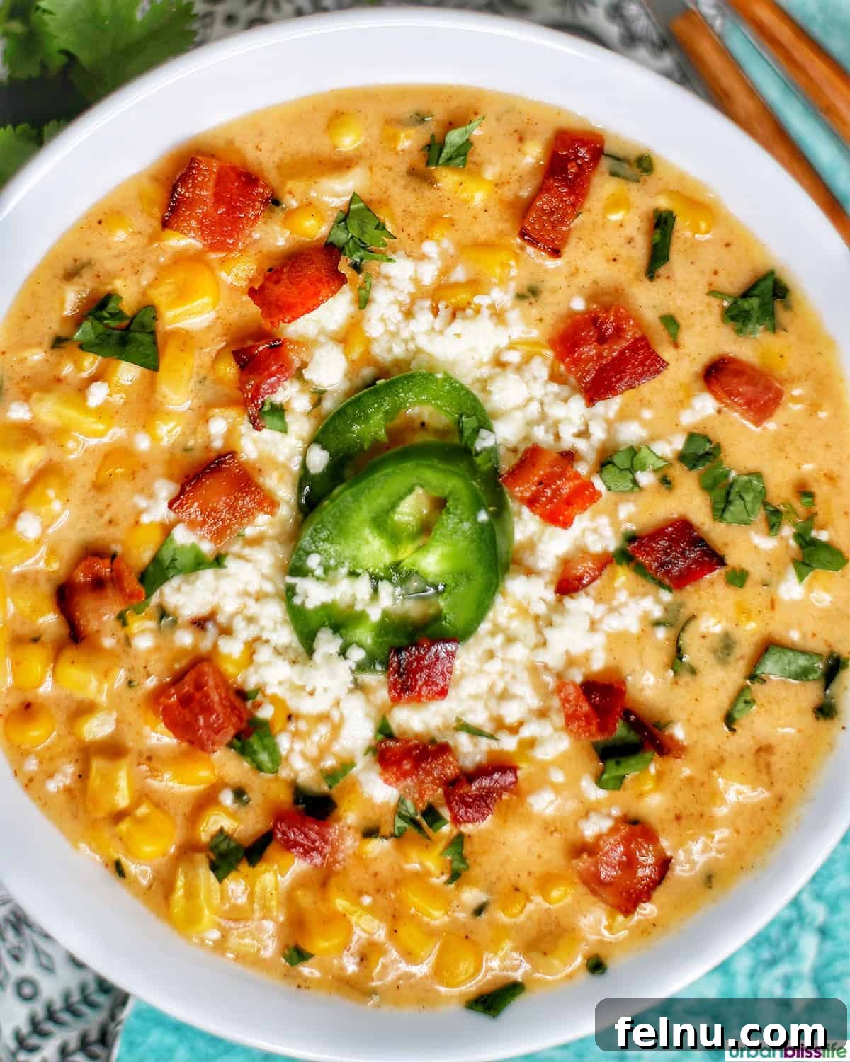 Creamy Instant Pot Mexican Corn Chowder 9 bowl of Instant Pot Mexican Street Corn Chowder with bacon, jalapenos, and Cotija cheese.