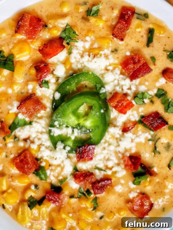 Creamy Instant Pot Mexican Corn Chowder 13 bowl of Instant Pot Mexican Street Corn Chowder with bacon, jalapenos, and Cotija cheese.