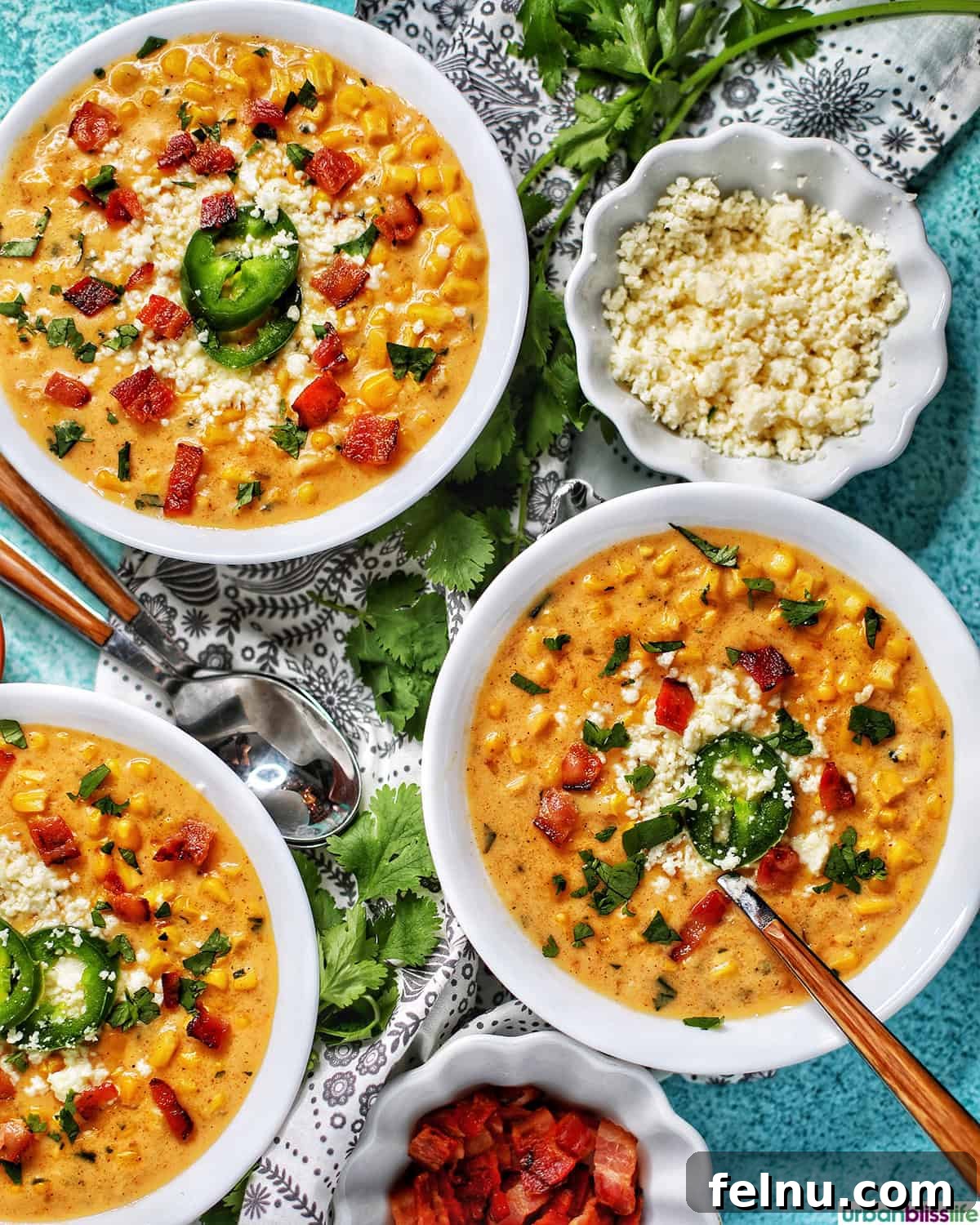 Creamy Instant Pot Mexican Corn Chowder 3 bowls of Instant Pot Mexican Street Corn Chowder with bacon, jalapenos, and Cotija cheese.